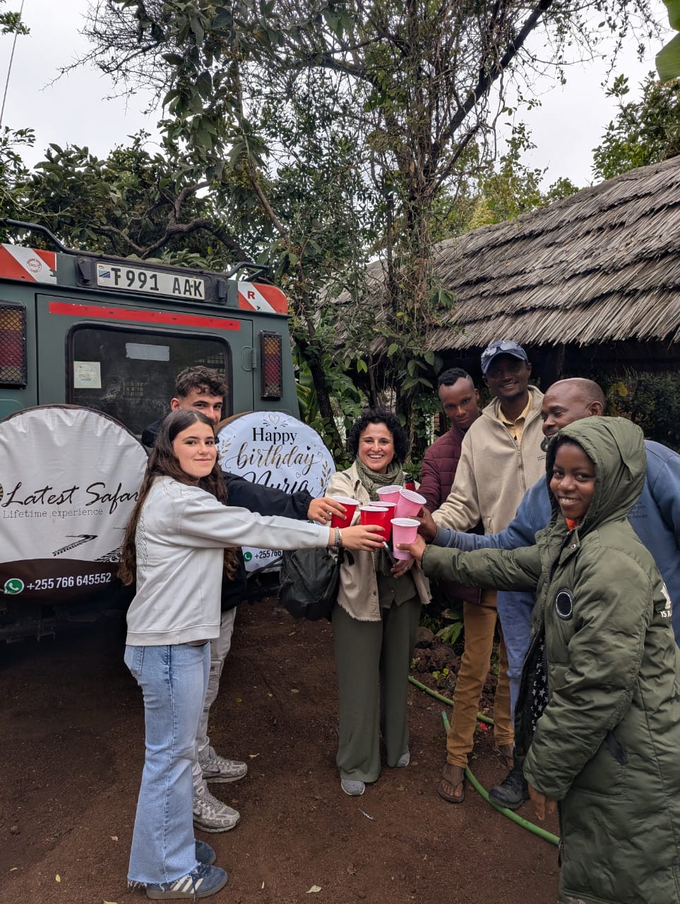 Guests and guides toasting together in Tarangire