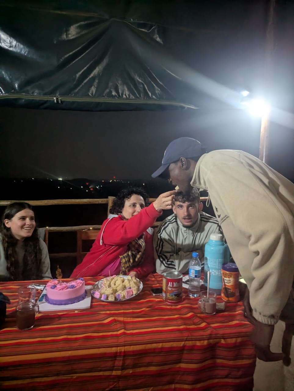 Cake and celebration under canvas